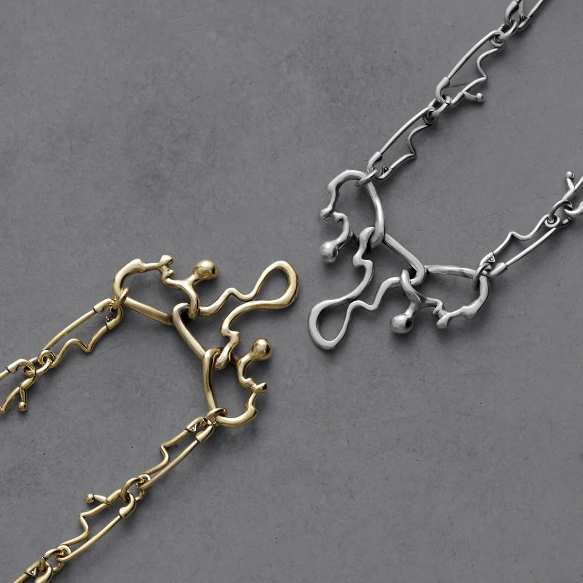 FLUID PIN NECKLACES